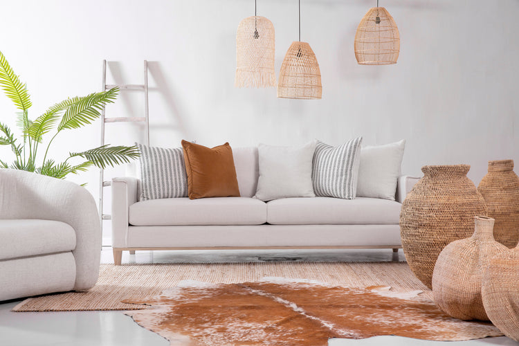 Modern beige and oak sectional sofa with chaise lounge in a living room setting