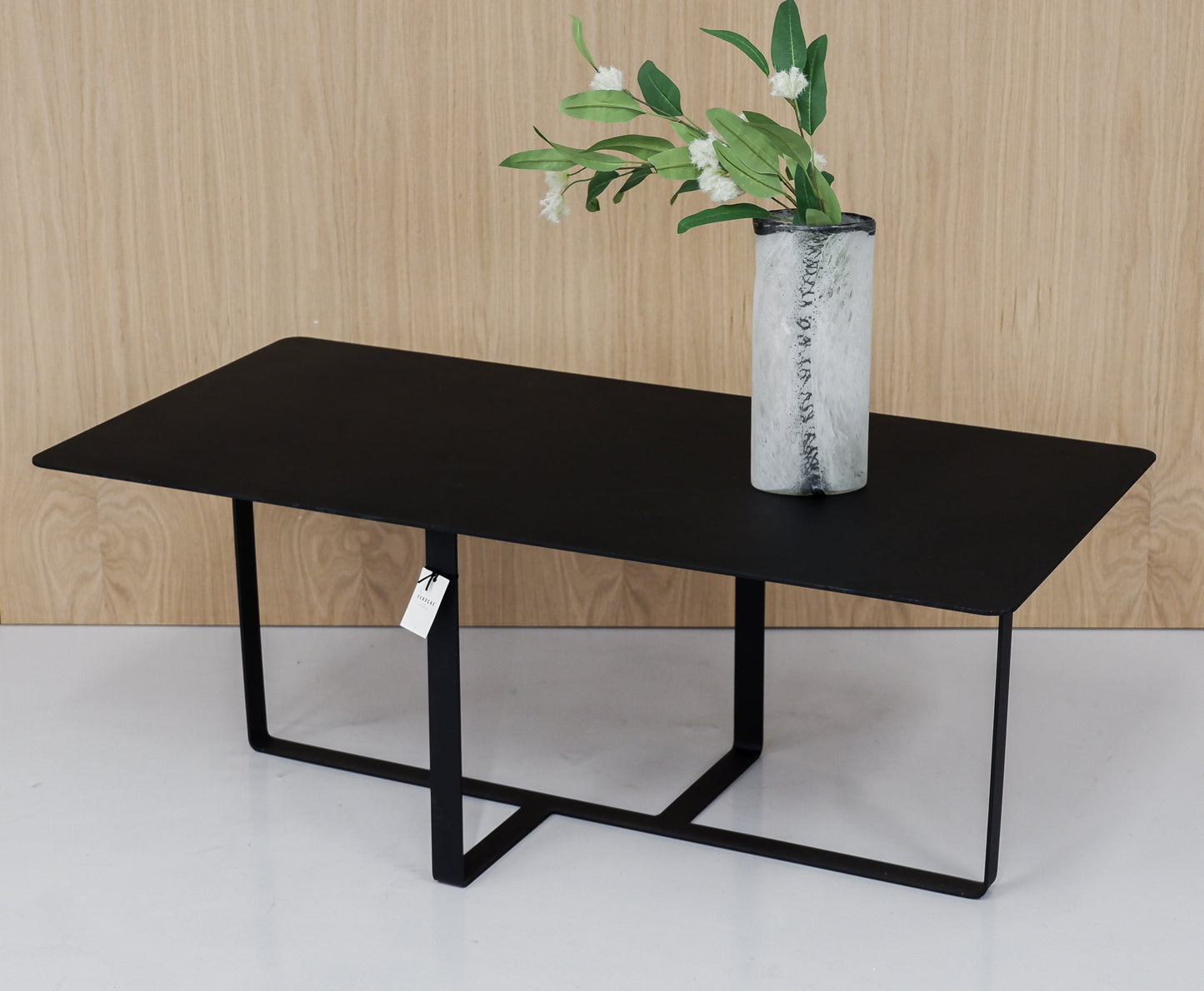 Durable black steel coffee table with a sophisticated and modern rectangular shape.