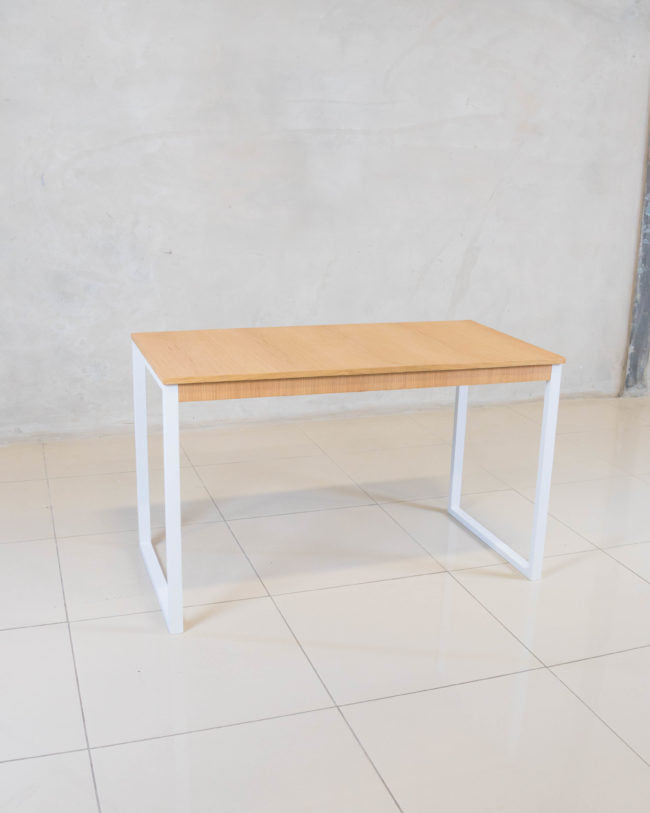 Side view of the Ivan Desk, showcasing its steel frame and oak veneer top, ideal for a stylish workspace.