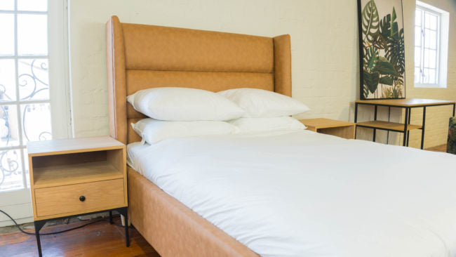 Side view of the Saloon Panel Upholstered Bed Set, showcasing its distinctive panel design.